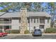 Charming condo with stone chimney, two stories, and a well-maintained landscaped front at 3852 Woodridge Way, Tucker, GA 30084