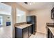 Kitchen showing the breakfast bar pass through that offers views into the living room at 3852 Woodridge Way, Tucker, GA 30084