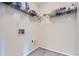 A practical laundry area equipped with shelving and hookups for appliances at 3852 Woodridge Way, Tucker, GA 30084