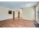 Bright living room featuring hardwood floors, large windows, and a pass-through to the kitchen at 3852 Woodridge Way, Tucker, GA 30084