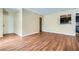 Spacious living area with hardwood floors and a pass-through window to the modern kitchen at 3852 Woodridge Way, Tucker, GA 30084
