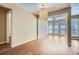 Spacious living room featuring a unique drum light fixture and large windows allowing for ample natural light at 3852 Woodridge Way, Tucker, GA 30084