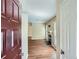 Inviting entryway view with an open floorplan to the living room, fireplace and hardwood flooring at 3852 Woodridge Way, Tucker, GA 30084
