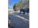 Exterior shot of a picnic area with tables under gazebos, in a wooded area for residents to enjoy outdoor leisure at 3852 Woodridge Way, Tucker, GA 30084