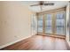 Inviting sunroom with wood floors, a ceiling fan, and abundant natural light at 3852 Woodridge Way, Tucker, GA 30084