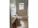 This bathroom features a bathtub, toilet, sink, and tile flooring at 409 Inman Sw St, Atlanta, GA 30310