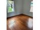 This bedroom features hardwood floors, two windows and white walls at 409 Inman Sw St, Atlanta, GA 30310