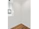 Bedroom with a modern light fixture and beautiful hardwood flooring at 622 Bellemeade Nw Ave # 4, Atlanta, GA 30318