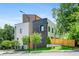 A modern townhome with a mix of light siding and dark brick, complemented by a landscaped front yard at 622 Bellemeade Nw Ave # 4, Atlanta, GA 30318