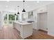 Bright, open kitchen featuring a large island, stainless steel appliances, and ample cabinet space at 622 Bellemeade Nw Ave # 4, Atlanta, GA 30318