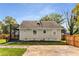 Charming home featuring a fenced backyard, a concrete patio, and an upper-level deck at 1471 Hardin Ave, College Park, GA 30337
