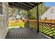 Stylish deck showcasing an intricate railing design and a view of the landscaped yard at 1471 Hardin Ave, College Park, GA 30337