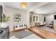 Bright and airy living room featuring a neutral color palette, hardwood floors, and ample natural light at 1471 Hardin Ave, College Park, GA 30337