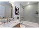 Beautiful bathroom featuring herringbone tile, marble countertops and modern fixtures at 1667 Grace Se St, Atlanta, GA 30316
