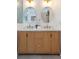 Bathroom showcasing a double vanity with modern sinks, stylish mirrors, and gold fixtures at 1667 Grace Se St, Atlanta, GA 30316