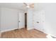 Well-lit bedroom showcasing a closet, ensuite bathroom entrance, and spacious hardwood floors at 1667 Grace Se St, Atlanta, GA 30316