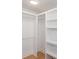 Spacious walk-in closet with custom built-in shelving and ample storage space at 1667 Grace Se St, Atlanta, GA 30316