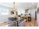 Bright dining room with hardwood floors open to a modern kitchen and living area at 1667 Grace Se St, Atlanta, GA 30316