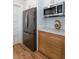 Kitchen with stainless steel refrigerator, microwave and wooden cabinets at 1667 Grace Se St, Atlanta, GA 30316