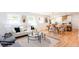 Open-concept living room and dining area with hardwood floors and lots of natural light at 1667 Grace Se St, Atlanta, GA 30316