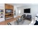 Comfortable living room with a media wall, modern furniture and hardwood floors at 1667 Grace Se St, Atlanta, GA 30316