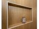 Built-in shower niche for storage in a modern bathroom with stylish wood-look tile walls at 1667 Grace Se St, Atlanta, GA 30316