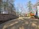 Expansive backyard with a playset, storage shed, and retaining wall, ideal for outdoor activities at 2157 Killian Nw Way, Kennesaw, GA 30152