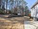 Large backyard featuring a shed, retaining wall, and plenty of open space at 2157 Killian Nw Way, Kennesaw, GA 30152