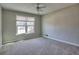 Comfortable bedroom with neutral walls, plush carpet, and a large window view at 2157 Killian Nw Way, Kennesaw, GA 30152