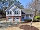 Charming two-story home with gray siding, brick accents, two-car garage and a welcoming front porch at 2157 Killian Nw Way, Kennesaw, GA 30152