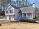 Charming two-story home with gray siding, brick accents, two-car garage and a welcoming front porch at 2157 Killian Nw Way, Kennesaw, GA 30152