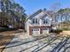 Inviting two-story home with a two-car garage and spacious driveway at 2157 Killian Nw Way, Kennesaw, GA 30152