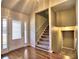 Inviting foyer featuring hardwood floors, a carpeted staircase, and a well-lit entryway at 2157 Killian Nw Way, Kennesaw, GA 30152
