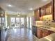 Bright eat-in kitchen with tiled floor, large windows, breakfast area, and stainless steel appliances at 2157 Killian Nw Way, Kennesaw, GA 30152