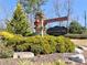 Elegant community entrance sign with stone pillars and lush landscaping at 2157 Killian Nw Way, Kennesaw, GA 30152