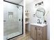 This renovated bathroom features a glass shower, modern fixtures, and attractive vanity at 2177 American Legion Rd, Dacula, GA 30019