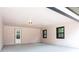 A spacious carport showcasing the neutral color scheme and lighting fixture on the ceiling at 2177 American Legion Rd, Dacula, GA 30019