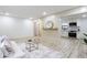 Living room view with hardwood floors, white walls, flows seamlessly into the kitchen area at 2177 American Legion Rd, Dacula, GA 30019