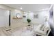 Bright living room with hardwood floors, white shiplap accent wall, and neutral furniture at 2177 American Legion Rd, Dacula, GA 30019