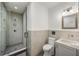 Modern bathroom featuring a walk-in shower with glass door, and gray and white walls at 11279 Serenbe Ln, Chattahoochee Hills, GA 30268