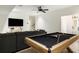Recreational room features a pool table, comfortable seating, and a mounted television at 11279 Serenbe Ln, Chattahoochee Hills, GA 30268