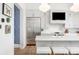 Island kitchen boasts a stainless steel refrigerator and mounted television at 11279 Serenbe Ln, Chattahoochee Hills, GA 30268