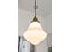 Close up of a pendant light with ornate gold trim at 11279 Serenbe Ln, Chattahoochee Hills, GA 30268