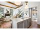 Open concept floorplan with an eat in kitchen, living room and staircase at 11279 Serenbe Ln, Chattahoochee Hills, GA 30268