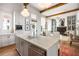 The kitchen island features stainless steel appliances, storage and an eat in counter at 11279 Serenbe Ln, Chattahoochee Hills, GA 30268