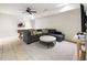 Spacious living room with a comfortable sectional sofa, a pool table, and a modern ceiling fan at 11279 Serenbe Ln, Chattahoochee Hills, GA 30268
