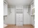Spacious walk-in closet with custom shelving, drawers, and ample storage for an organized wardrobe at 11279 Serenbe Ln, Chattahoochee Hills, GA 30268