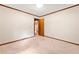 Bedroom with neutral carpet and view to the kitchen at 1184 Alemeda Dr, Marietta, GA 30066
