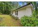 Side exterior of home featuring white siding and neat landscaping at 1184 Alemeda Dr, Marietta, GA 30066