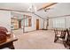 Spacious living room featuring a chandelier, ceiling fan, and decorative wood trim at 1184 Alemeda Dr, Marietta, GA 30066